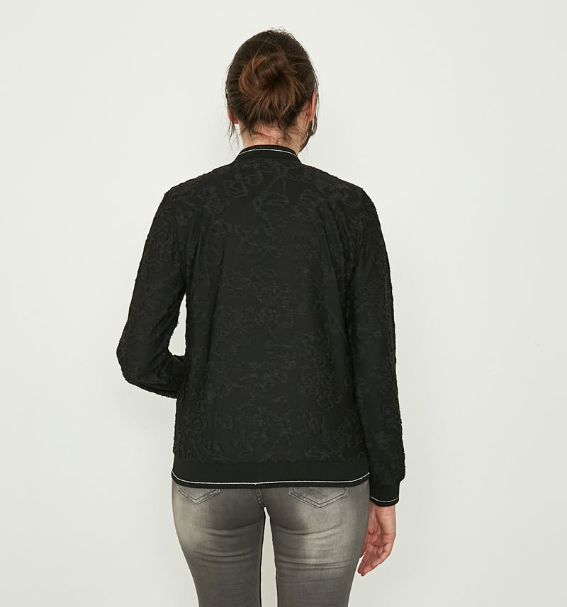 Ausbrenner-Muster Rosen in schwarz-glänzend, Kontrastfarben Innenfutter, am Bund Silberfaden, Reißverschluss.  Wir empfehlen die gewohnte Größe zu wählen. 75% Viskose, 25% Polyester Handwäsche bei 30°C